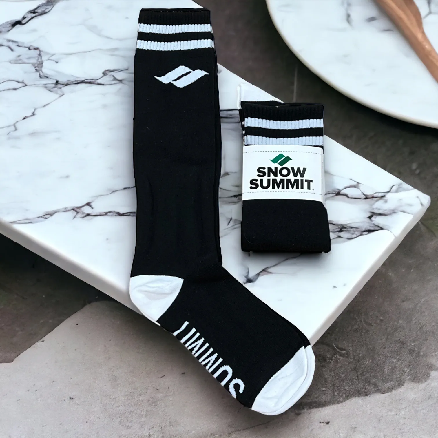 Black Snow Summit socks with white snow summit logo on side of sock and bottom of sock
